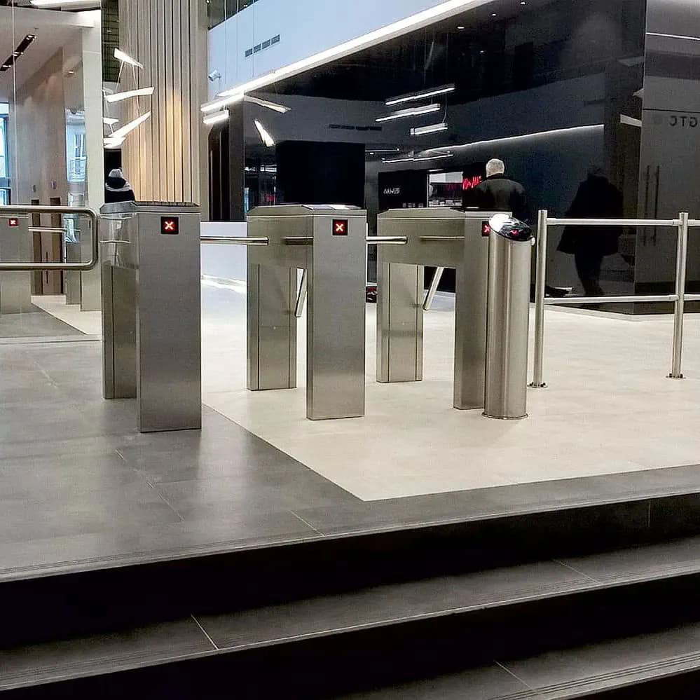 A NextPass access control turnstile and card reader installed on site